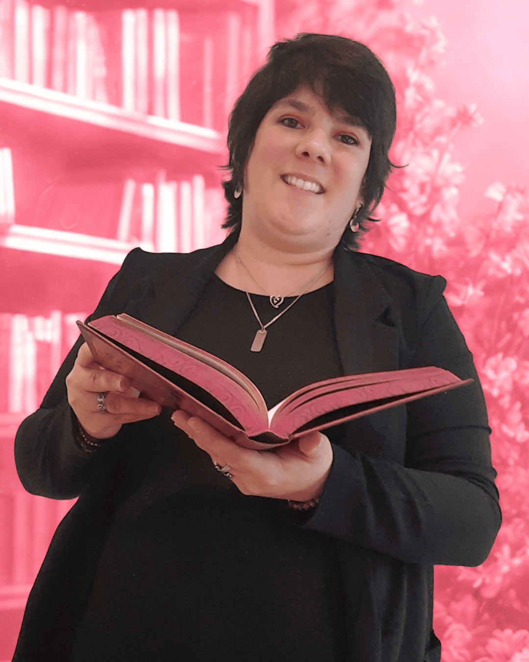 Wendy Baqué est aussi chroniqueuse littéraire ! Wendy Baqué est aussi chroniqueuse littéraire - Wendy, habillée en noir, qui sourit et tient un livre rose ouvert devant elle, avec une bibliothèque et des fleurs en fond.